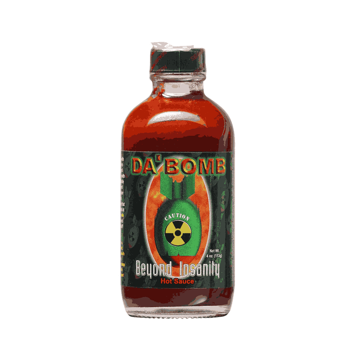 A bottle of DA BOMB Beyond Insanity hot sauce with a label featuring a green and red design and a cartoon nuclear bomb graphic.